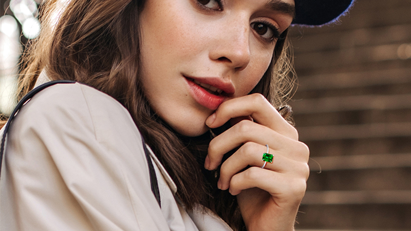 women wearing emeralds ring
