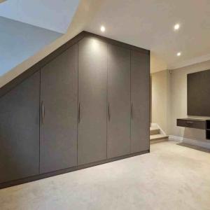 Enhancing Your Bedroom: Custom Fitted Wardrobes with LED Lighting and Interior Drawers